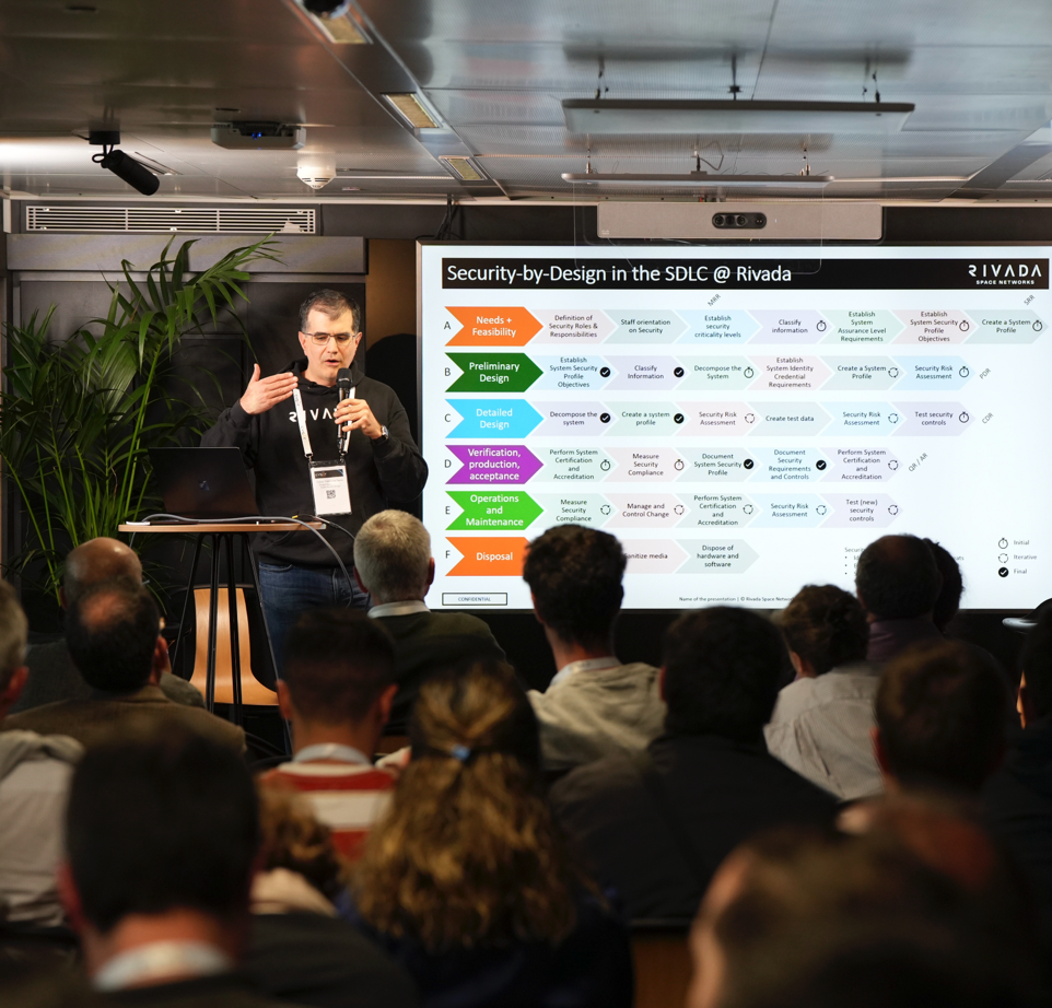 Formal man with tablet giving presentation in office